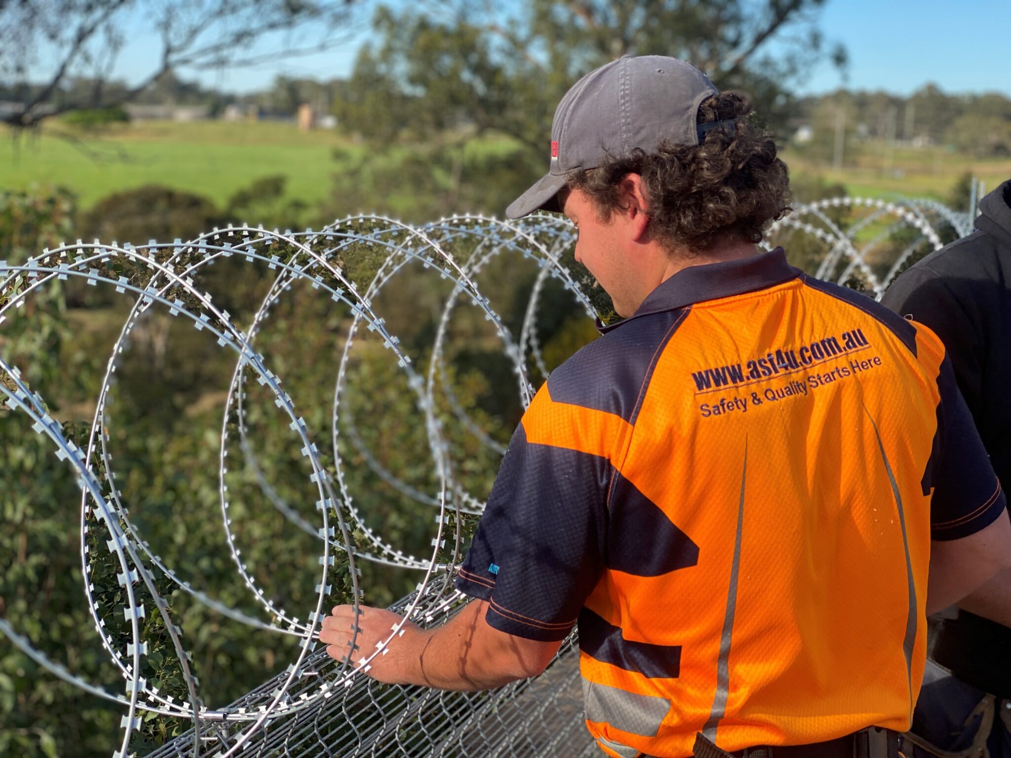 550 Concertina Install Razar Tape® Security Fencing, Barbed Tape or Razor Wire is fabricated with razor sharp steel blades and installed by Australian Security Fencing